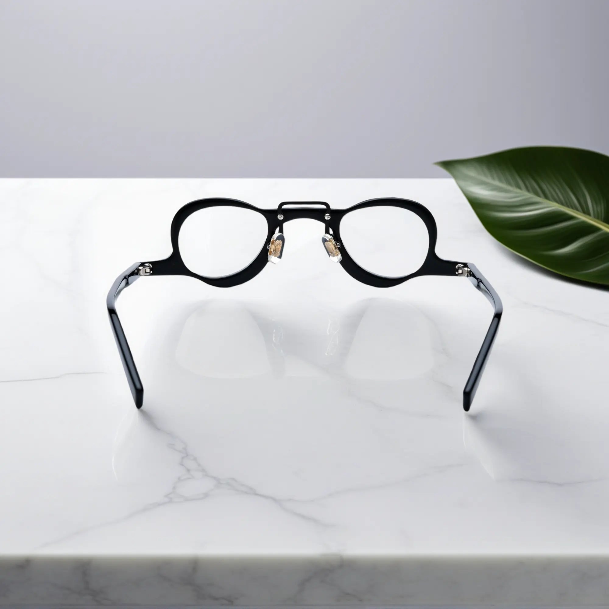 Back view showing the nano-polished black acetate frame of VoyueLens eyeglasses with ergonomic silicone nose pads.